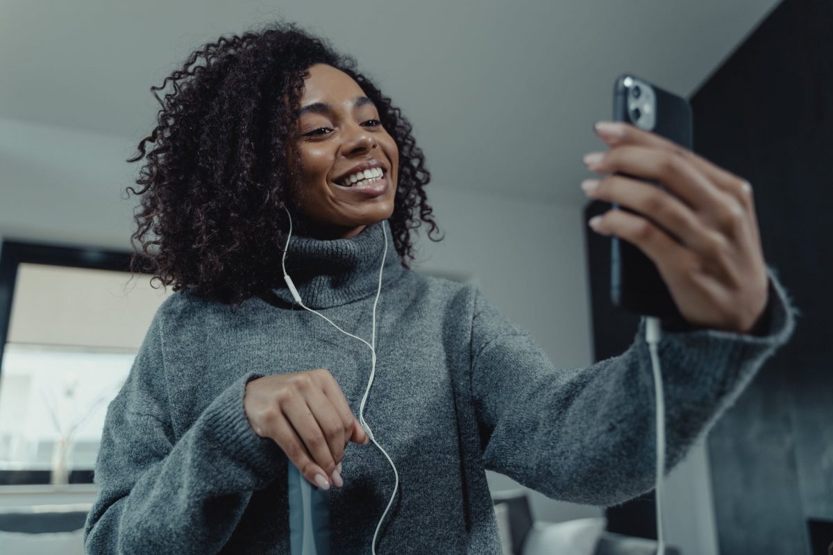 woman wearing a gray sweater on a video call